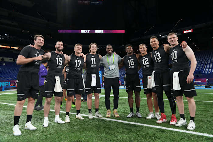 Mar 3, 2022; Indianapolis, IN, USA; Nevada quarterback Carson Staterong (QB14), Kansas State quarterback Skylar Thompson (QB15), Western Kentucky quarterback Bailey Zappe (QB17), Pittsburgh quarterback Kenny Pickett (QB11), Liberty quarterback Malik Willis (QB16), Iowa State quarterback Brock Purdy (QB12), Cincinnati quarterback Desmond Ridder (QB13) and Brown quarterback E J Perry (QB10) pose during the NFL Scouting Combine at Lucas Oil Stadium. Mandatory Credit: Kirby Lee-USA TODAY Sports